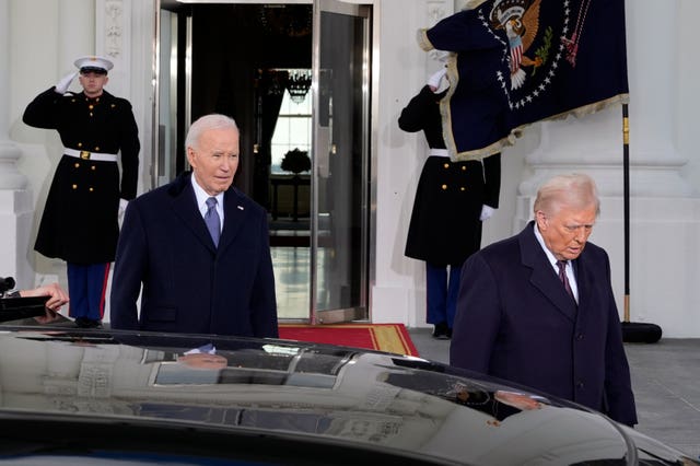 President Joe Biden and President-elect Donald Trump walk out to the presidential limousine, as they depart the White House in Washington en route to the Capitol