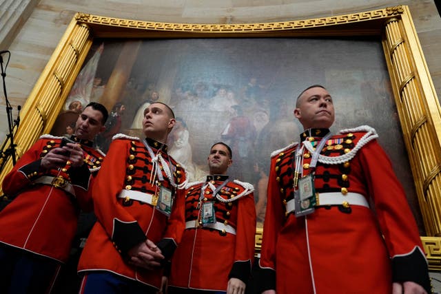 Members of the US Marine Band, The President’s Own, arrive before the 60th Presidential Inauguration in the Rotunda of the US Capitol in Washington 