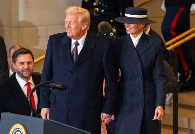 President Donald Trump and first lady Melania Trump arrive in Emancipation Hall after the 60th Presidential Inauguration at the US Capitol in Washington