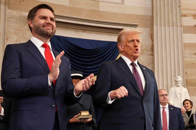 Vice president-elect JD Vance and President-elect Donald Trump arrive during the 60th Presidential Inauguration in the Rotunda of the US Capitol in Washington 