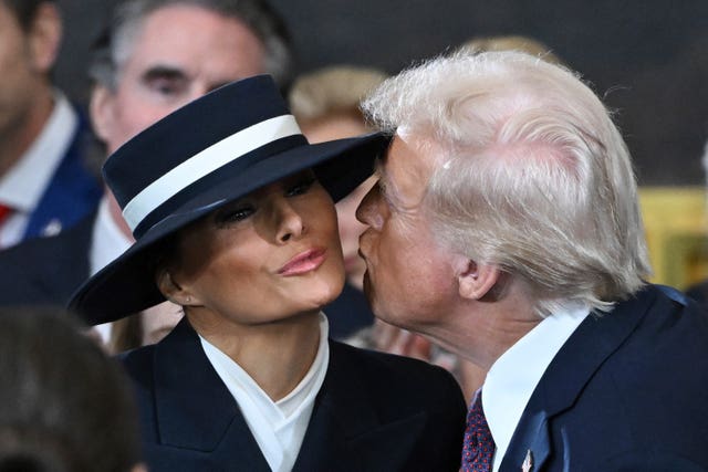 President-elect Donald Trump kisses Melania Trump before the 60th Presidential Inauguration in the Rotunda of the US Capitol in Washington 