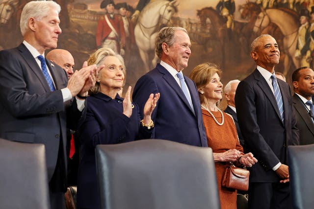 Former president Bill Clinton, former secretary of state Hillary Clinton, former president George W Bush, former first lady Laura Bush and former president Barack Obama in the Rotunda of the US Capitol in Washington 