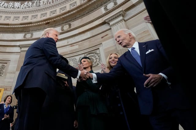 President Donald Trump shakes hands with former president Joe Biden after being sworn in as the 47th president of the United States during the 60th Presidential Inauguration in the Rotunda of the US Capitol in Washington