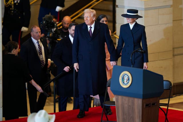 President Donald Trump and first lady Melania Trump arrive to speak at Emancipation Hall after the 60th Presidential Inauguration at the US Capitol in Washington 