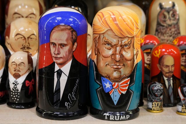 Traditional Russian wooden dolls called Matryoshka depicting Russian President Vladimir Putin, front left, and US President-elect Donald Trump, front right