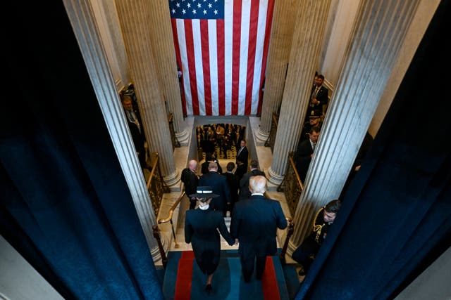 President Donald Trump and first lady Melania Trump depart after the 60th Presidential Inauguration in the Rotunda of the US Capitol in Washington