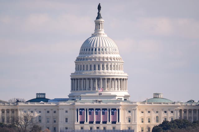 The US flag at the US Capitol is at full height on the day of the 60th Presidential Inauguration in Washington