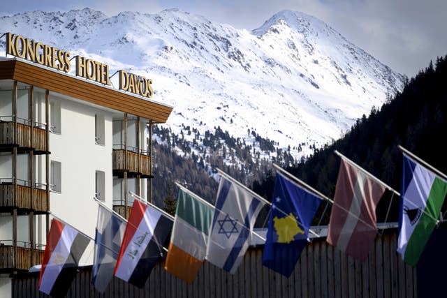 Countries’ flags fly on the roof of the congress center in front of Kongress Hotel prior to the 55th annual meeting of the World Economic Forum, WEF, in Davos, Switzerland