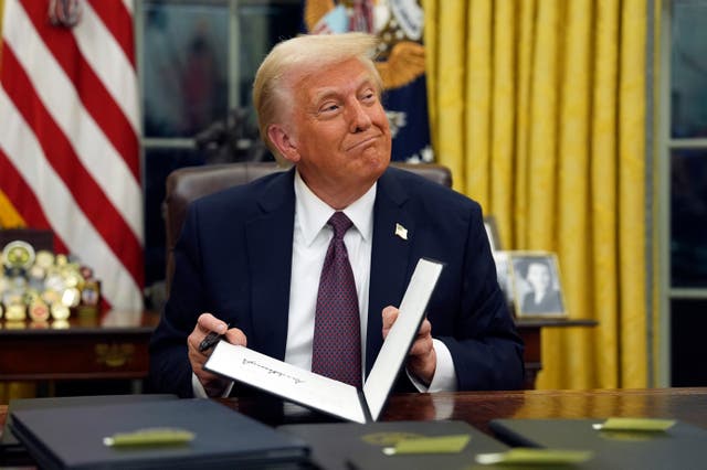 Donald Trump signs a bill