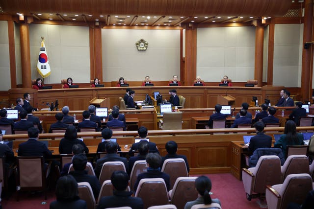 Impeached South Korean President Yoon Suk Yeol, far right, attends his impeachment trial at the Constitutional Court in Seoul, South Korea