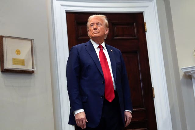 President Donald Trump listens in the Roosevelt Room at the White House 