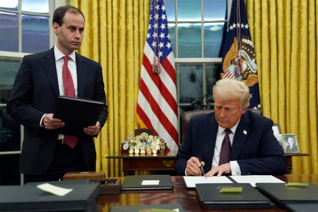 President Donald Trump signing an executive order in the White House