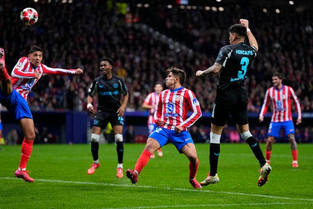 Piero Hincapie, front right, heads Bayer Leverkusen in front against Atletico Madrid