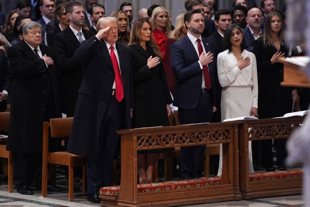 Donald Trump salutes, alongside first lady Melania Trump, vice president JD Vance and his wife Usha Vance during the national prayer service at the Washington National Cathedral