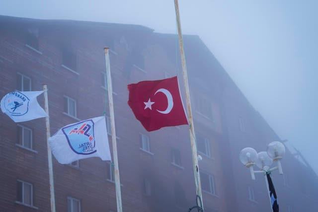 A Turkish flag flag flies at half staff outside the hotel 