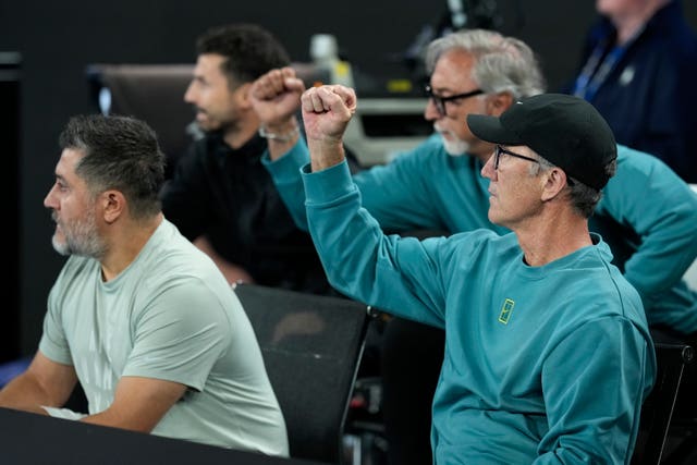 Coach Darren Cahill, right, cheers on Jannik Sinner 