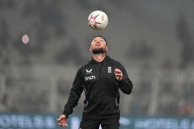 Brendon McCullum heads a football