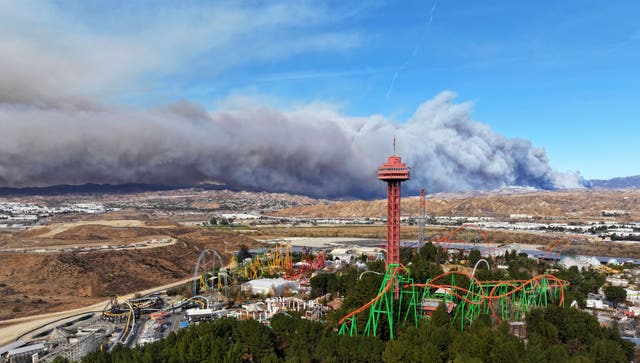 The tower at Six Flags Magic Mountain with the Hughes fire burning in Castaic 