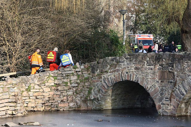 Rescue and security worker are seen near a crime scene in Aschaffenburg, Germany 