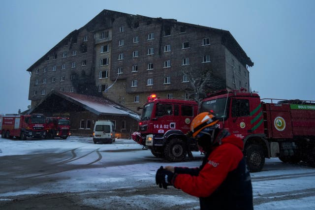 Firefighters and emergency teams work on the aftermath