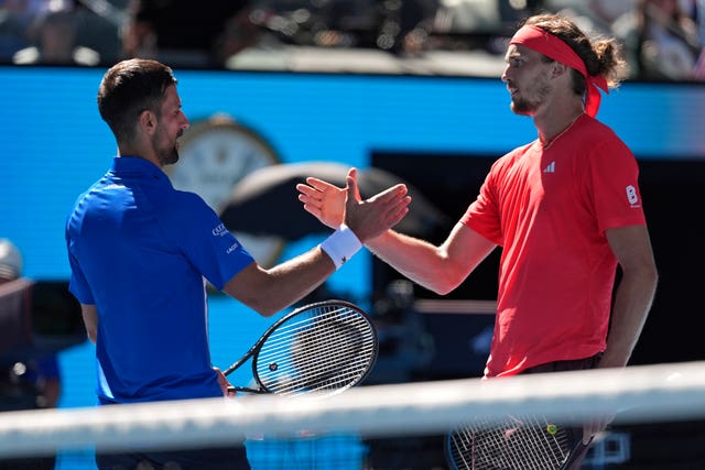 Alexander Zverev,of Germany shakes hands with Novak Djokovic as the Serb retires from their semi-final 