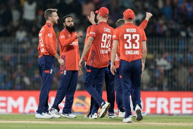 England’s Adil Rashid, second left, celebrates with teammates after the dismissal of India’s Arshdeep Singh