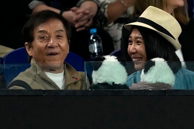 Actor Jackie Chan watches on