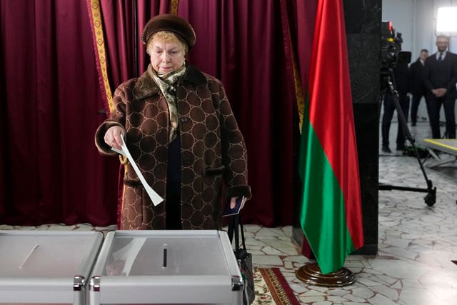 A woman casts her ballot at a polling site