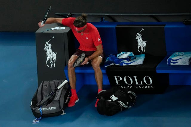 Alexander Zverev slams his racket into his bag after losing the second set