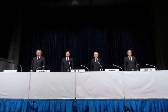 Japanese business executives at a press conference