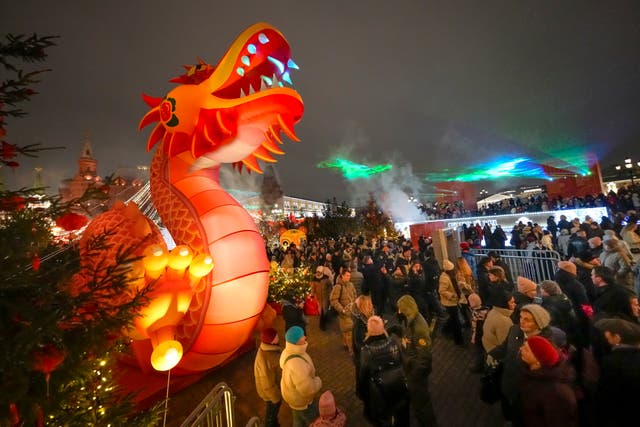 People celebrate the Lunar New Year, Year of the Snake, with a large procession near the Kremlin in Moscow,