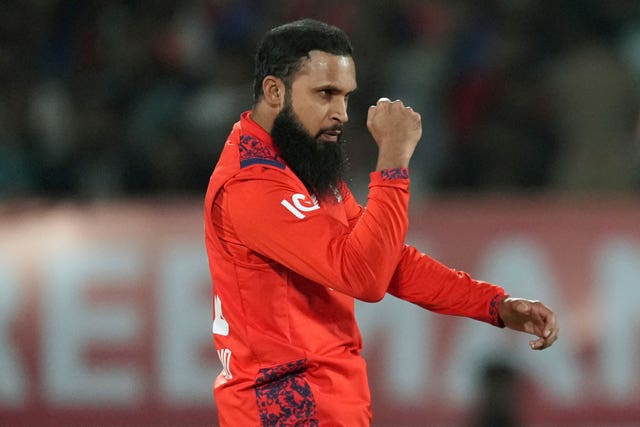 Adil Rashid celebrates taking a wicket