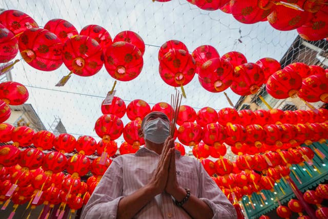 An Ethnic Chinese Thai prays at Kwong Siew Shrine to celebrate the Lunar New Year in Bangkok,