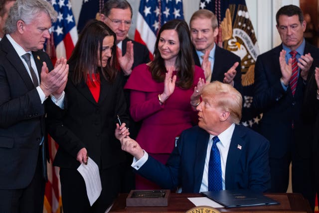 Donald Trump with Allyson Phillips, the mother of Laken Riley, after signing the Laken Riley Act