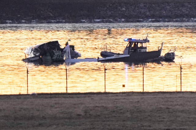 Search and rescue efforts (Mark Schiefelbein/AP)