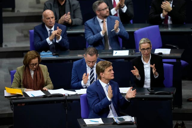 The managing director of the parliamentary group of Germany’s far-right Alternative for Germany party Bernd Baumann and his party react after German MPs narrowly voted against a bill to restrict immigration proposed by the conservative CDU/CSU with the controversial support of the AfD during a debate at the Bundestag focusing on immigration in Berlin, Germany 