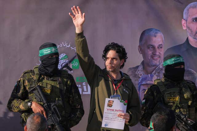 Ofer Kalderon waves after his release