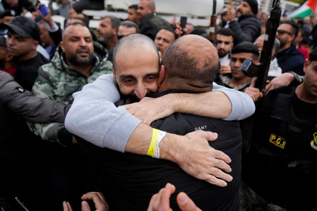 A Palestinian prisoner is hugged