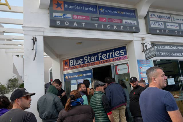 People wait to buy boat and air tickets