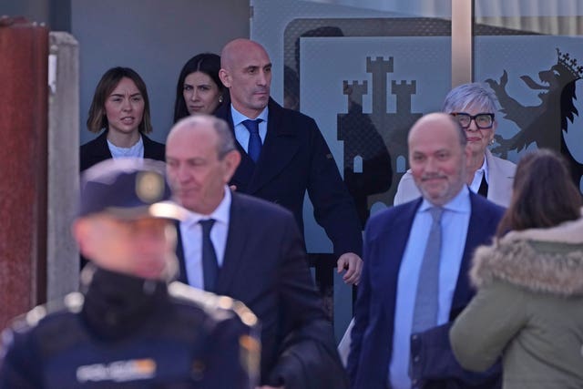 Luis Rubiales, top, leaves the court