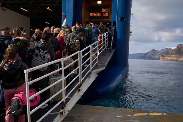 Passengers board a ferry