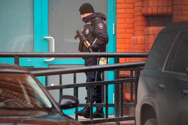 Police officer stands guard