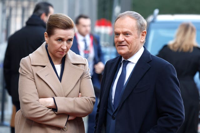 Denmark’s Prime Minister Mette Frederiksen speaks with Poland’s Prime Minister Donald Tusk at a summit in Brussels