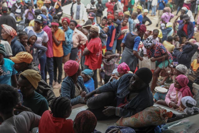 People displaced by armed gang attacks take refuge at the town hall of the Kenscoff area of Port-au-Prince