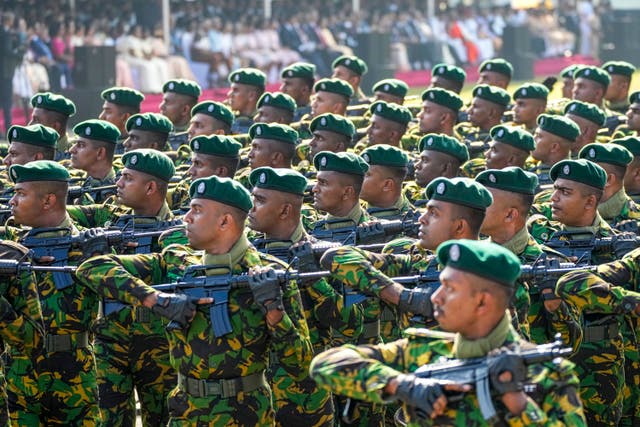 Members of the military march in sync