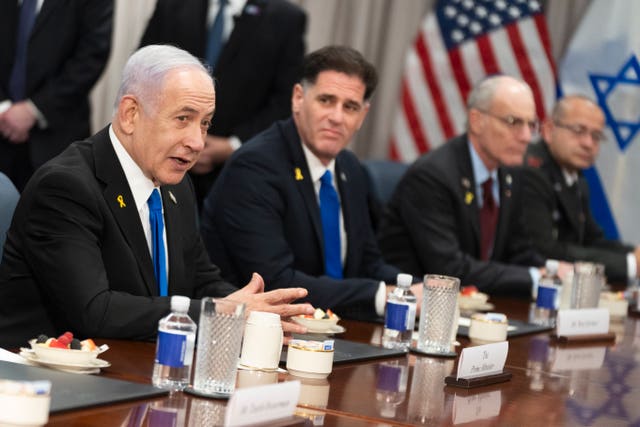 Israeli Prime Minister Benjamin Netanyahu, left, gives his opening statement before the start of a meeting with. Secretary of Defense Pete Hegseth at the Pentagon