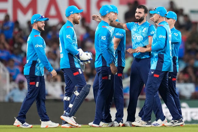 Saqib Mahmood, third right, celebrates a wicket