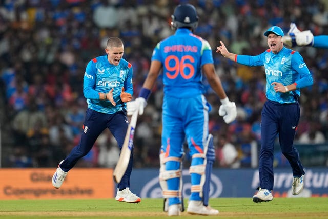 Jacob Bethell, left, celebrates taking the wicket of Shreyas Iyer