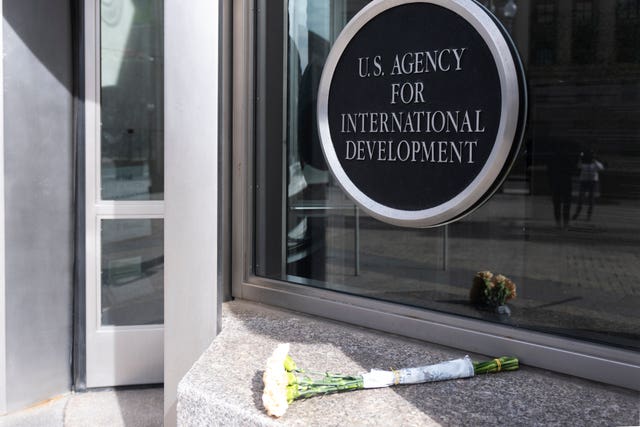 A bouquet of white flowers outside the headquarters of the United States Agency for International Development