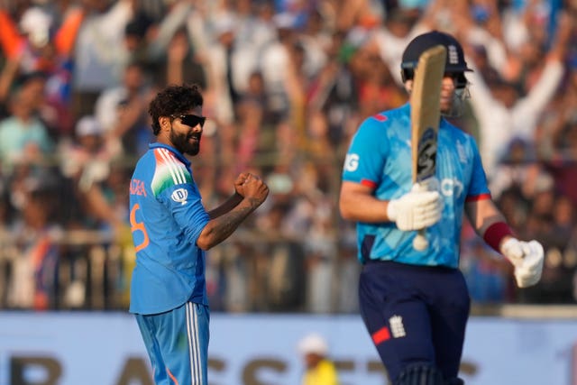 Ravindra Jadeja, left, celebrates the wicket of England’s Joe Root